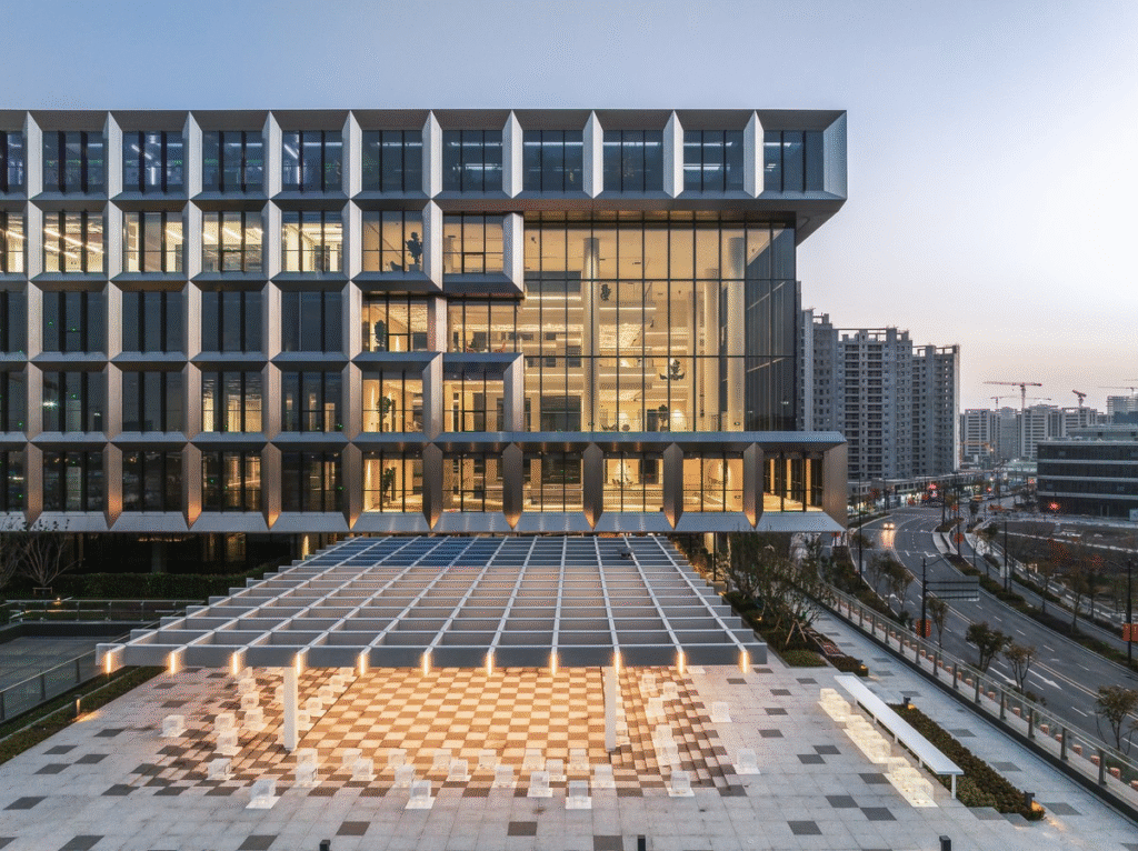 DeepSeek Releases V3.2-Exp: Revolutionizing AI with Sparse Attention Technology 4 Exterior view of a modern AI research laboratory building in Shanghai, China, showcasing advanced architectural design and technology hub setting